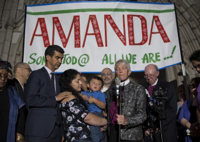 Amanda Morales holds her son, David, during a press conference about her decision to take sanctuary in Holyrood Church. She is flanked by interfaith leaders and New York City Councilman Ydanis Rodríguez. "It's been challenging to seek refuge, to live as a prisoner that cannot leave the church without risking being deported," says Amanda. "Besides, one is not ready to give interviews and speak to journalists. My kids always ask me: 'Why, mom? Why?'" Manhattan, New York City, United States. September 27, 2017.
